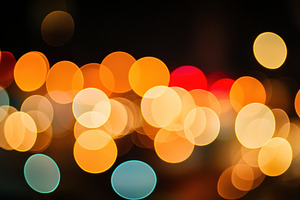 Warm defocused bokeh lights in orange, yellow, and blue tones on, an Abstract Photo by José Manuel Gelpi