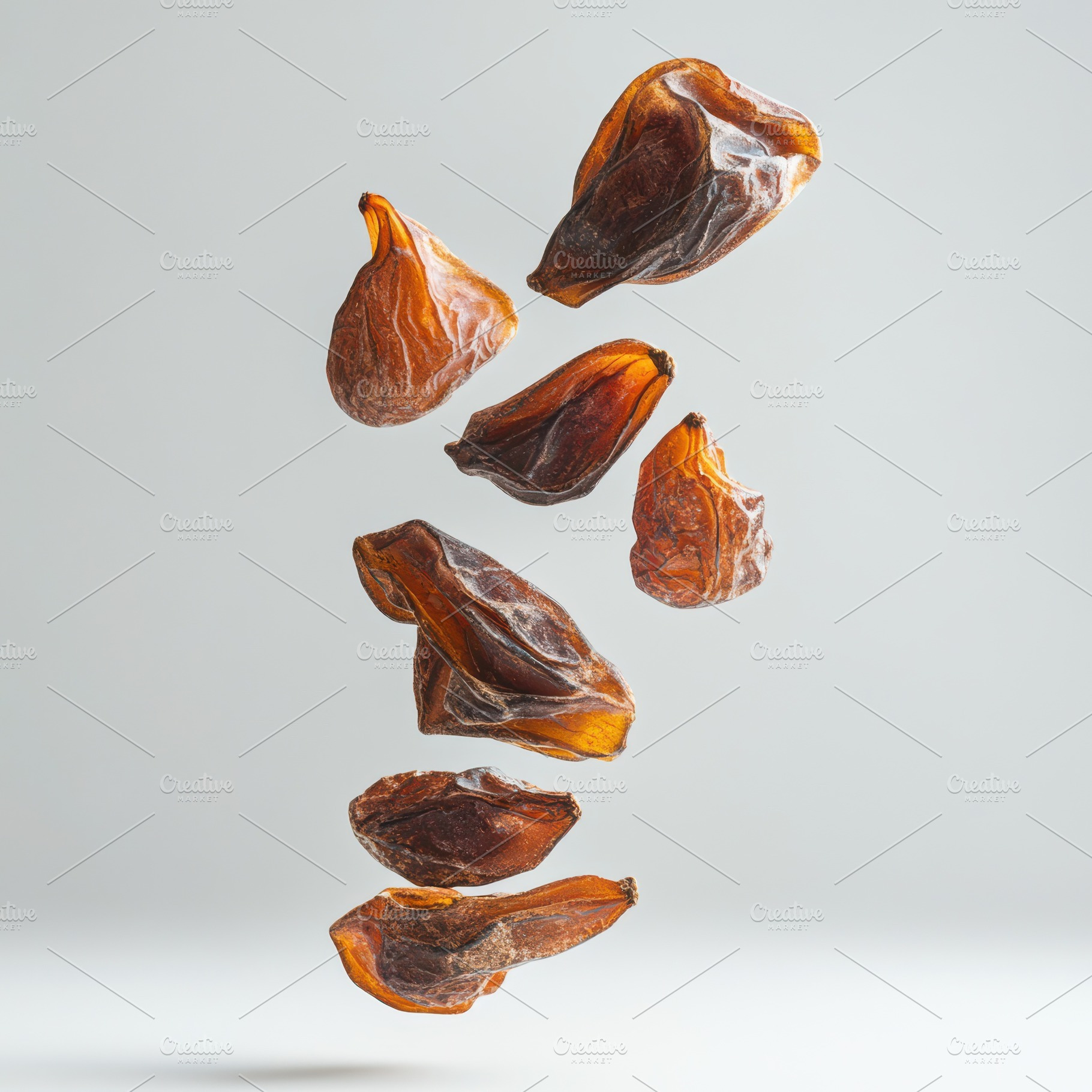 Delicious dried dates isolated on tr, a Food & Drink Photo by Pixeness Studio