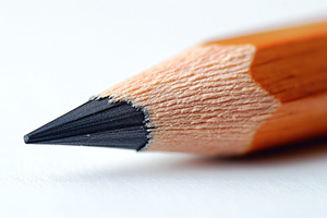 Close-up of a sharpened wooden pencil highlighting its fine tip and natural tex, a Background Photo by ImageMir