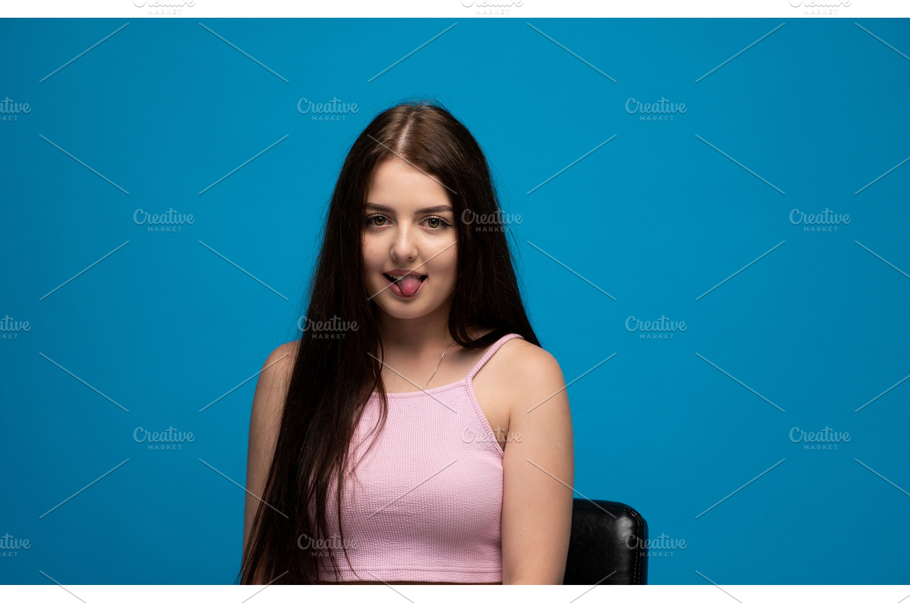 Young woman playfully sticking out, a Person Photo by volodymyrshtun13795