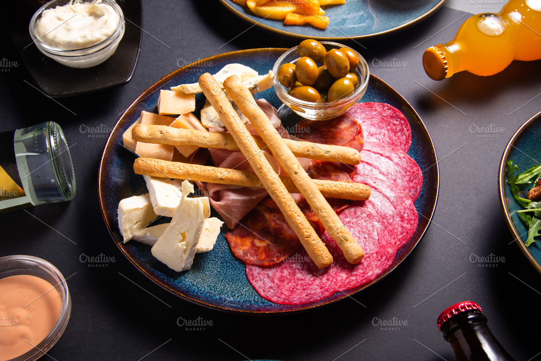 Beer snack plate with cheese, salami, ham, bacon, jamon, breadst, a Food & Drink Photo by MDBildes