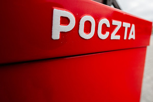 Red postal box with Polish text 'Poczta' in Krakow, Poland, a Photo by AS photostudio