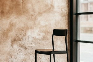 Empty chair and workspace with books, a Photo by Dvoevnore photos