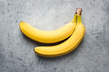 Fresh bananas on concrete background, a Food & Drink Photo by The baking man