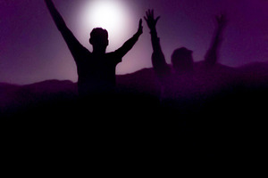 Silhouettes celebrating under full moon, a Person Photo by DanFLCreativo