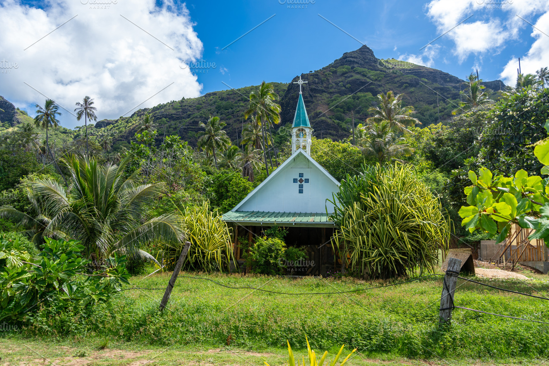 Small church in Anaho Bay, Nuku Hiva, French Polynesia, amid lus, an Architecture Photo by GoodGoods