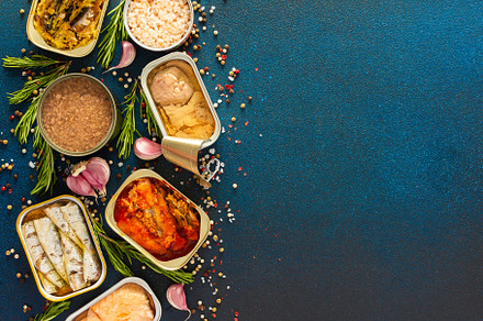Different open tin cans, a Food & Drink Photo by Pandateam