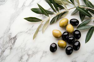 Olives arranged on a marble surface, a Photo by Pavel_design