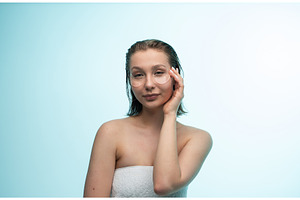 Young woman applying under eye, a Health & Medical Photo by volodymyrshtun13795