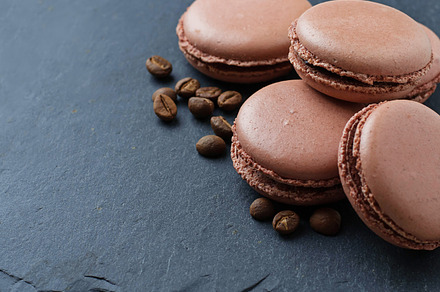 French macaroons with coffee beans containing sweet, background, and baked, a Food & Drink Photo by Yulia Furman