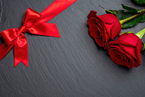 Red roses and ribbon on dark background, a Holiday Photo by Davizro's Market