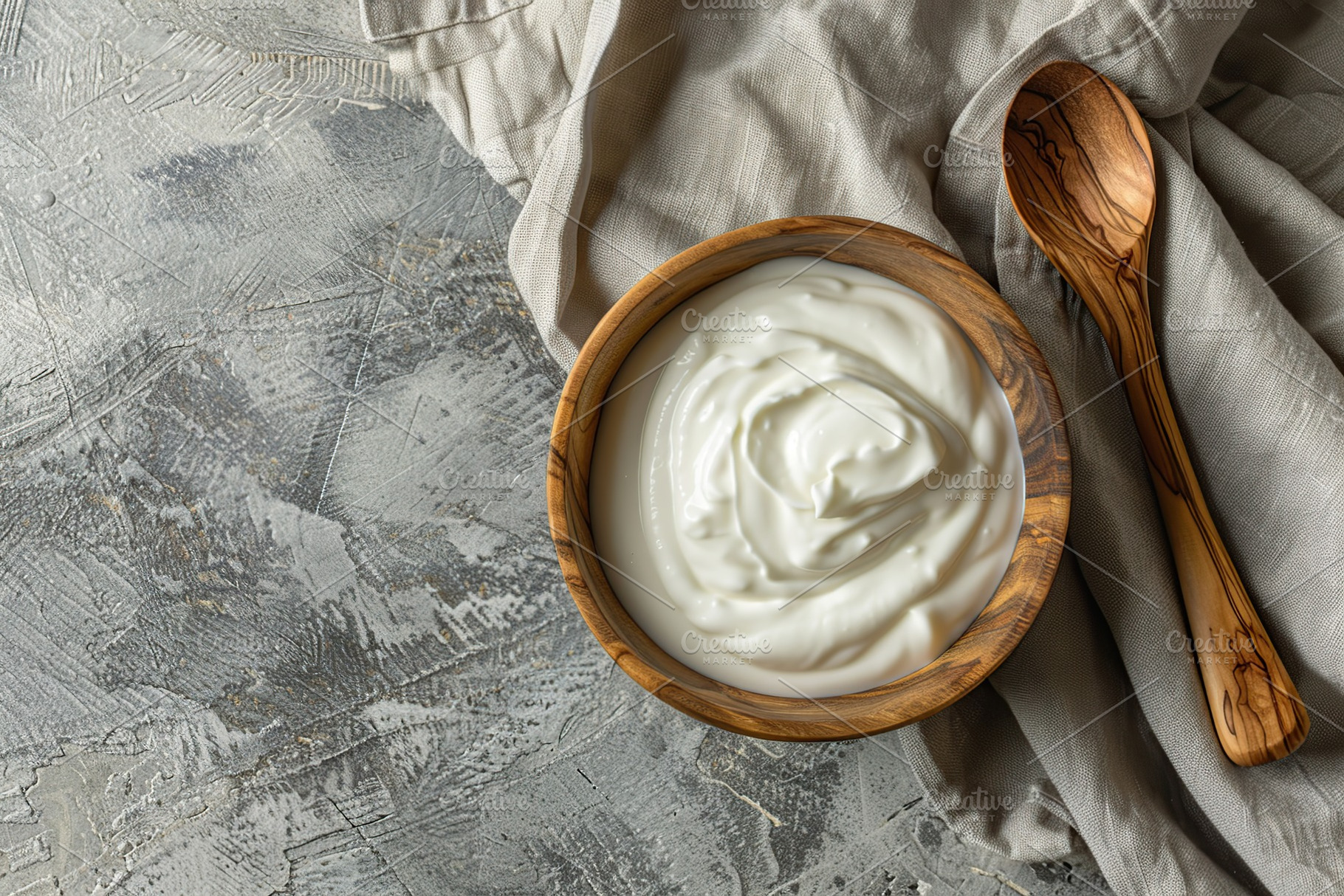 Bowl with white yogurt on grey background, a Food & Drink Photo by AlyaAnd