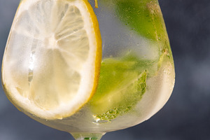 Refreshing Hugo Spritz cocktail with lemon mint ice bubbles and