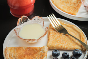 Pancakes with blueberry and honey on a white plate, a Food & Drink Photo by Budarinphoto
