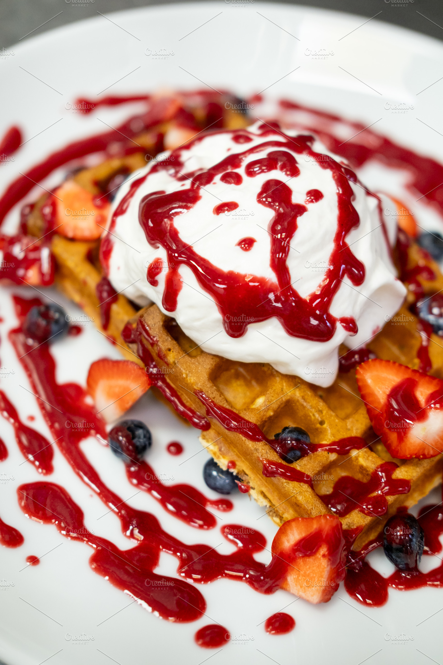 Garnished dessert breakfast served wafer jam berry, a Food & Drink Photo by Photo Drive Studio