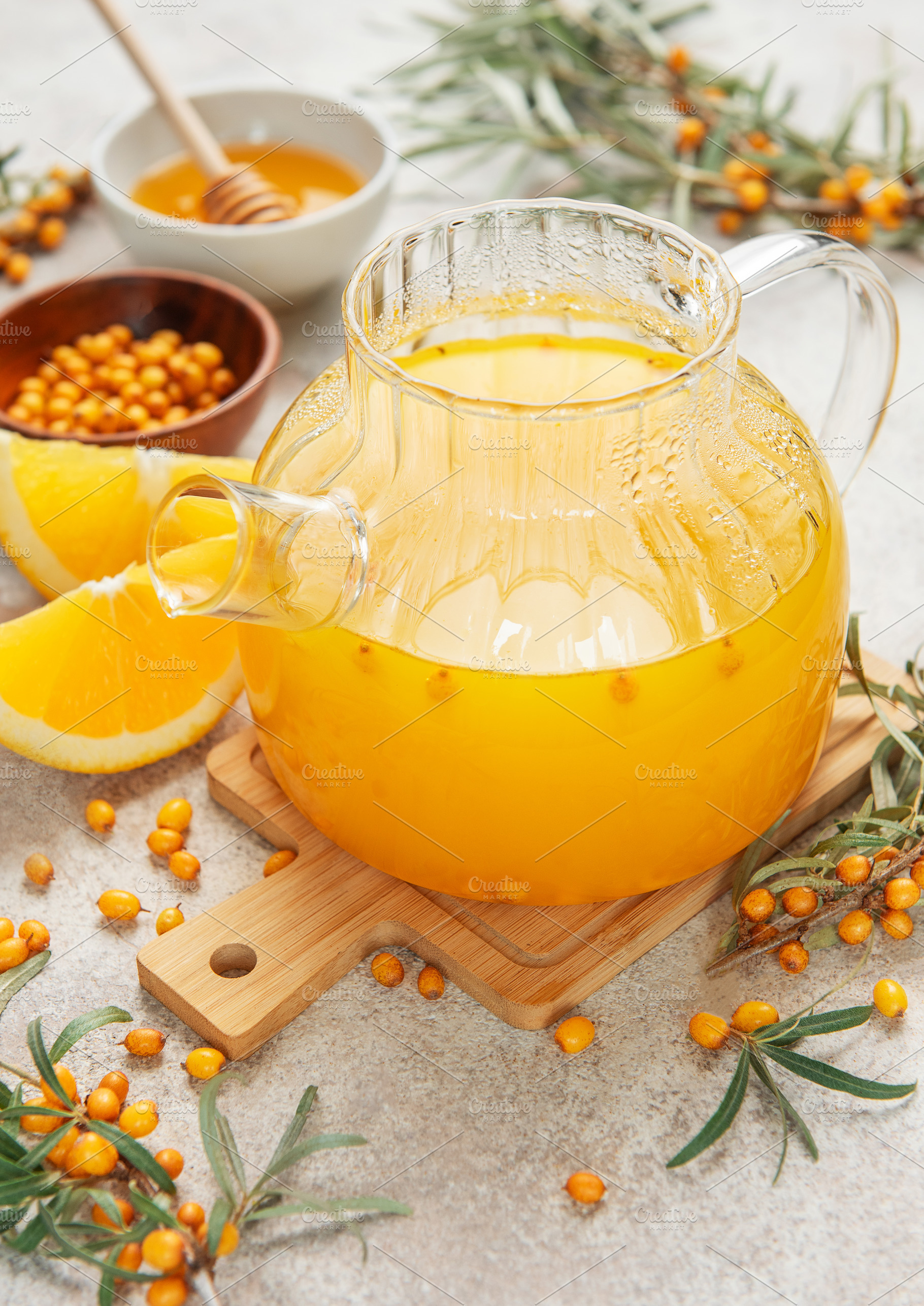 Warming sea buckthorn tea with orange slices and honey, a Food & Drink Photo by Olena Rudo
