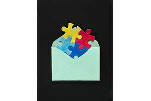 Colorful puzzle pieces in a mint, a Photo by tilialucida
