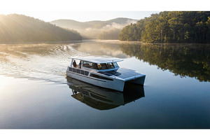 Solar powered catamaran boating on a, a Transportation Photo by Igor Tichonow
