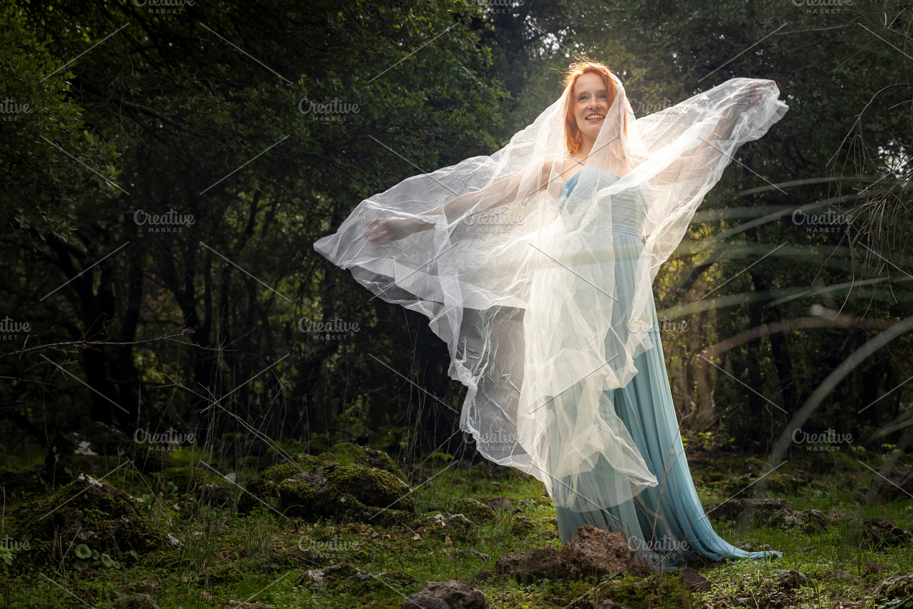 Happy woman in a blue gown, a Person Photo by Imaginarium