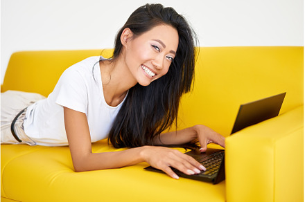 Pretty smiling woman using laptop, a Person Photo by Gladkov photography
