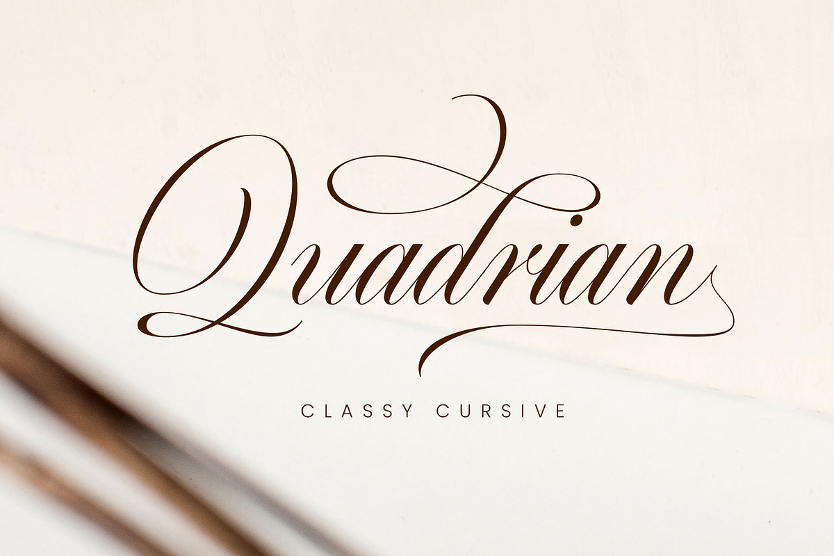 Quadrian - Elegant Script, a Script Font by Arterfak Project (Photo 1 of 13)