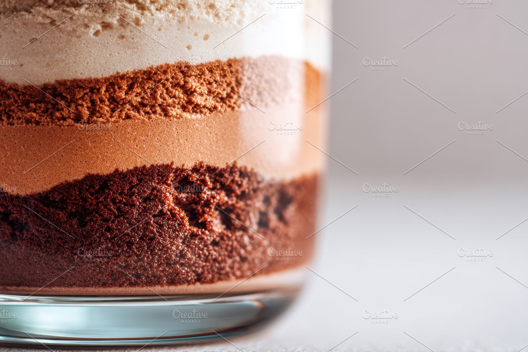 Colorful layered dessert in a glass, a Food & Drink Photo by AlyaAnd