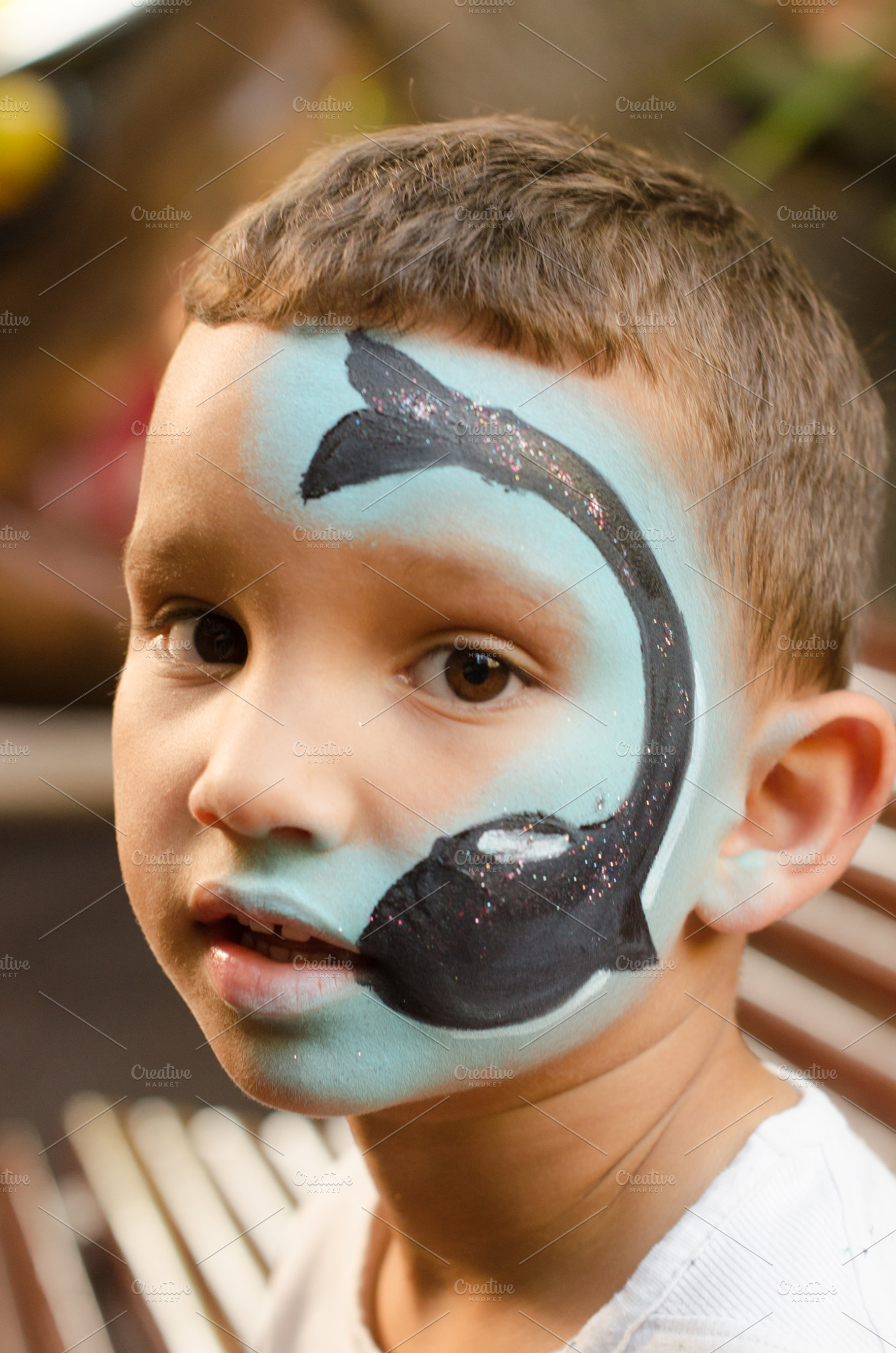 Child with painted face., an Arts & Entertainment Photo by BREATING NATURE