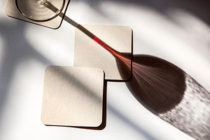shadow of a glass of red wine, a Photo by UN-BRANDED
