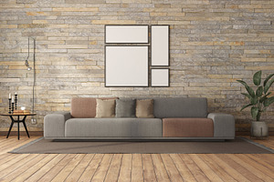 Minimalist living room with sofa against stone wall