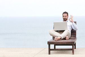 Businessman freelance on beach with laptop containing beach, laptop, and