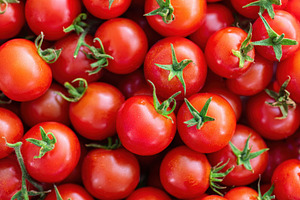 Background of ripe and red tomato cherry, a Food & Drink Photo by AlyaAnd