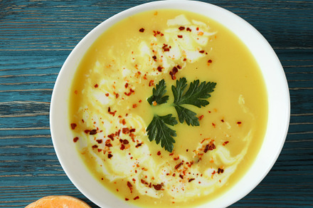 Concept of tasty food with pumpkin soup on wooden table, a Food & Drink Photo by AtlasStudio