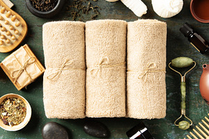 Luxury Spa Flatlay with Towels, Tea, and Natural Wellness Tools