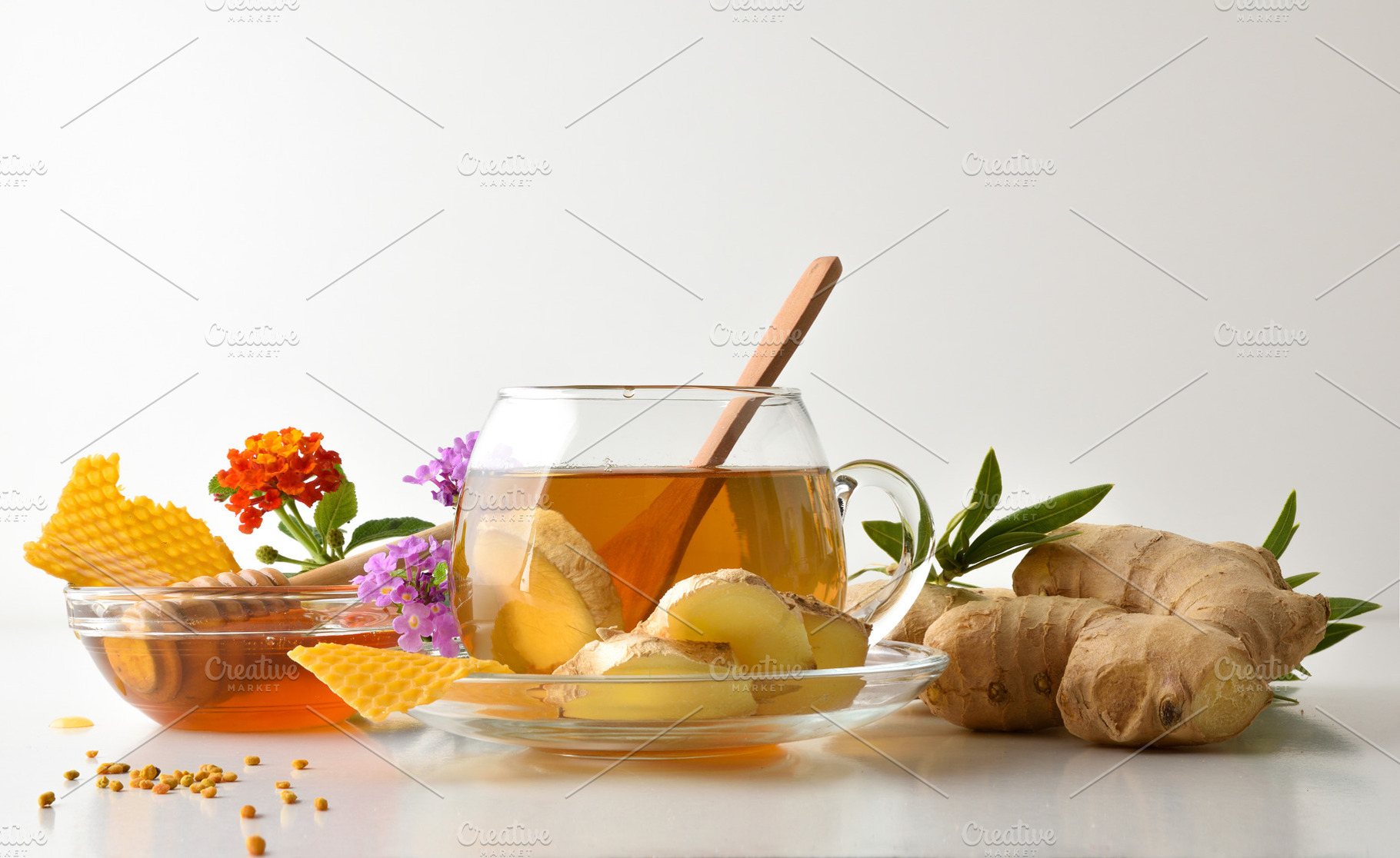 Background with glass cup with ginger and honey infusion isolate, a Food & Drink Photo by Davizro's Market