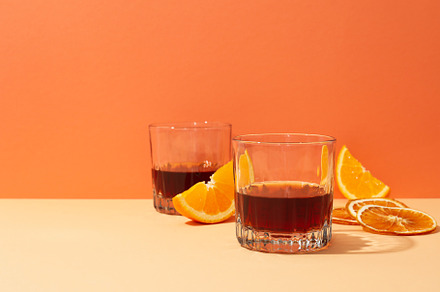 Concept of delicious alcohol drink, Whiskey with orange, a Food & Drink Photo by AtlasStudio PRO