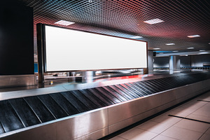 Blank billboard at the baggage claim, a Transportation Photo by SkyNext