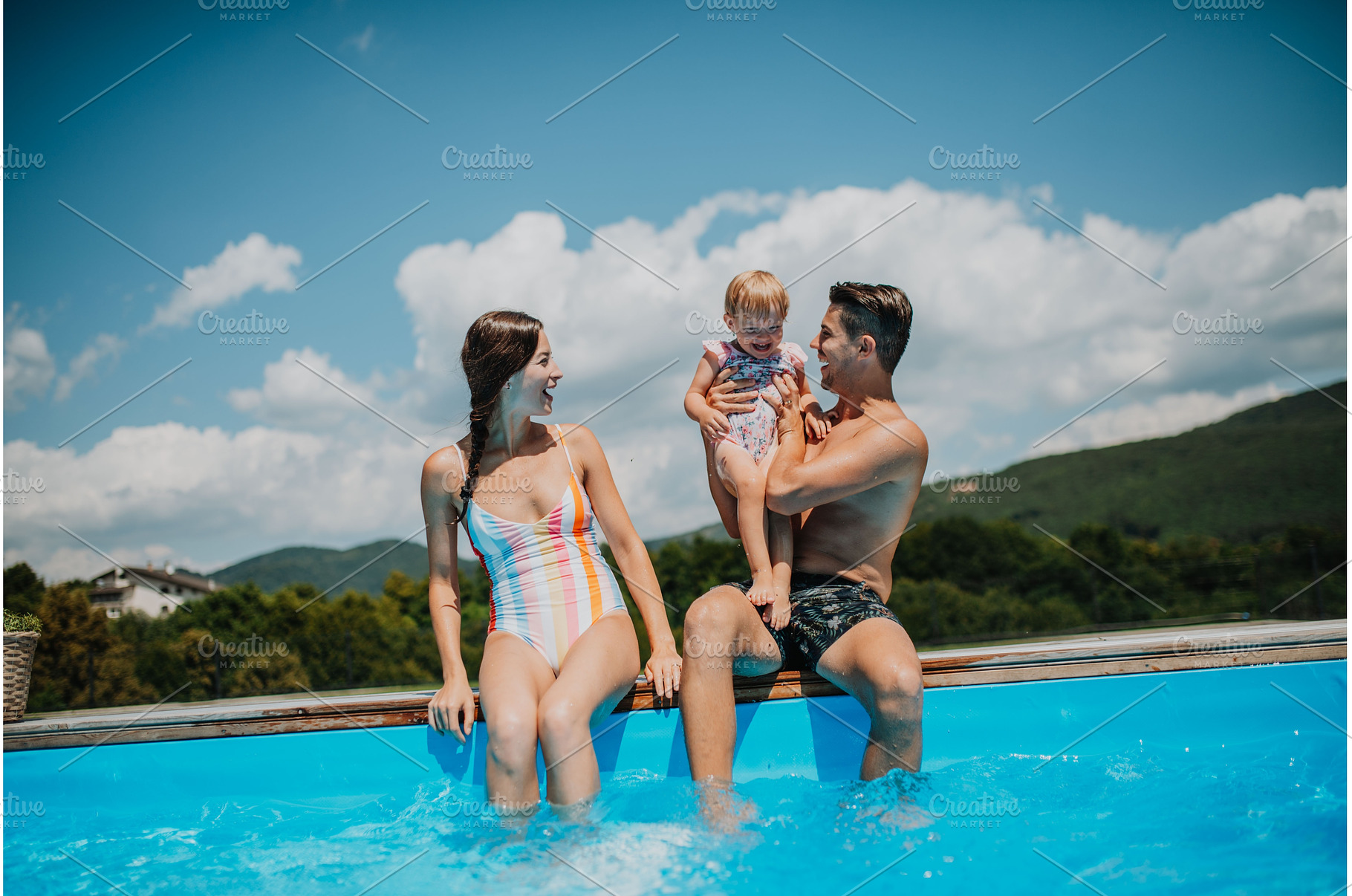 Young family with small daughter in, a Person Photo by HalfPoint