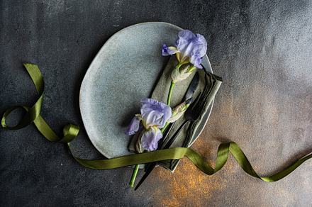 Table setting with pale blue iris flowers