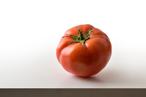 Single Fresh Tomato on White Background, a Food & Drink Photo by Davizro's Market