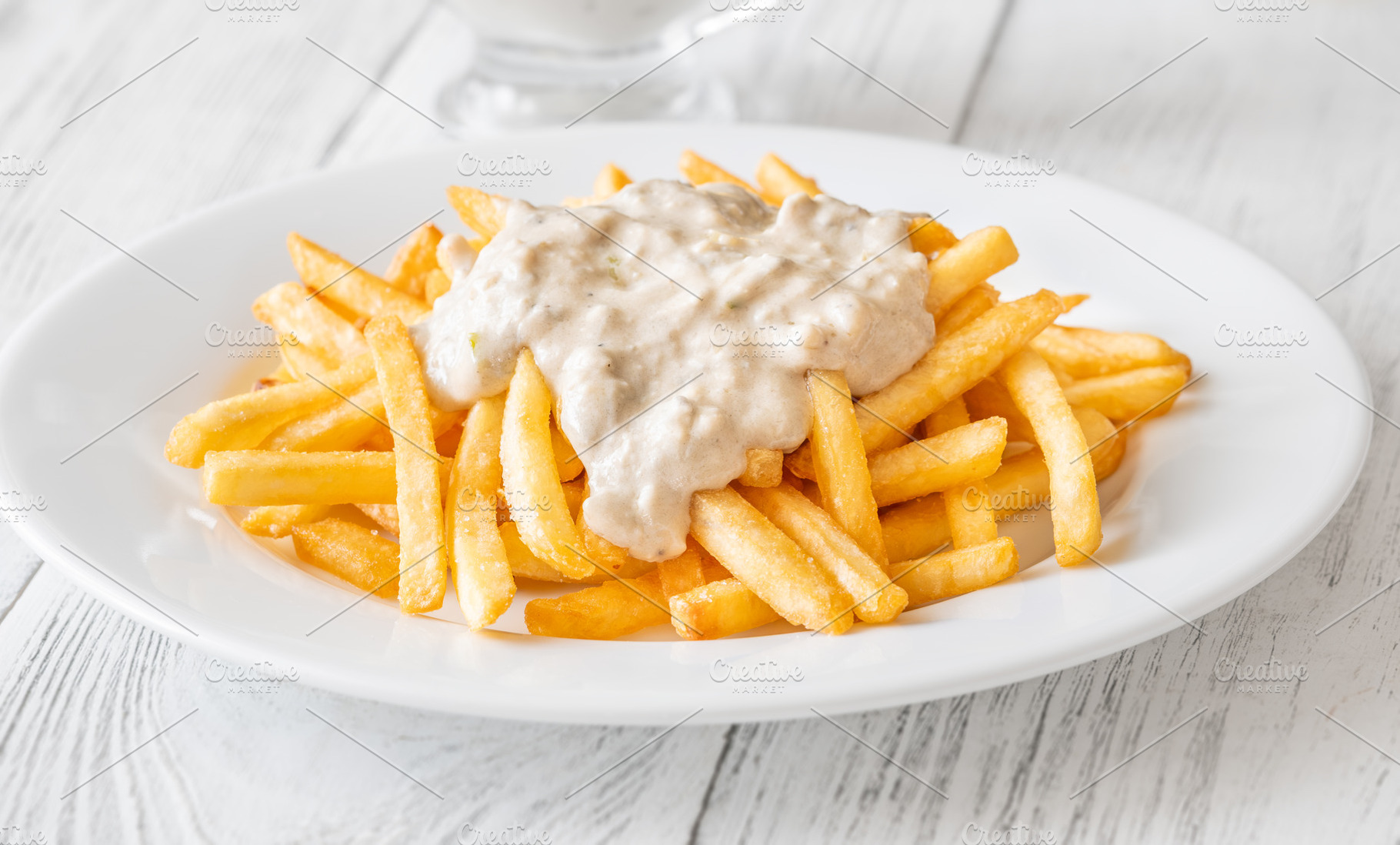 Golden fries drizzled with rich blue, a Food & Drink Photo by Alexander Prokopenko