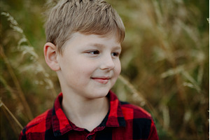 Portrait of young boy standing in, a Person Photo by HalfPoint