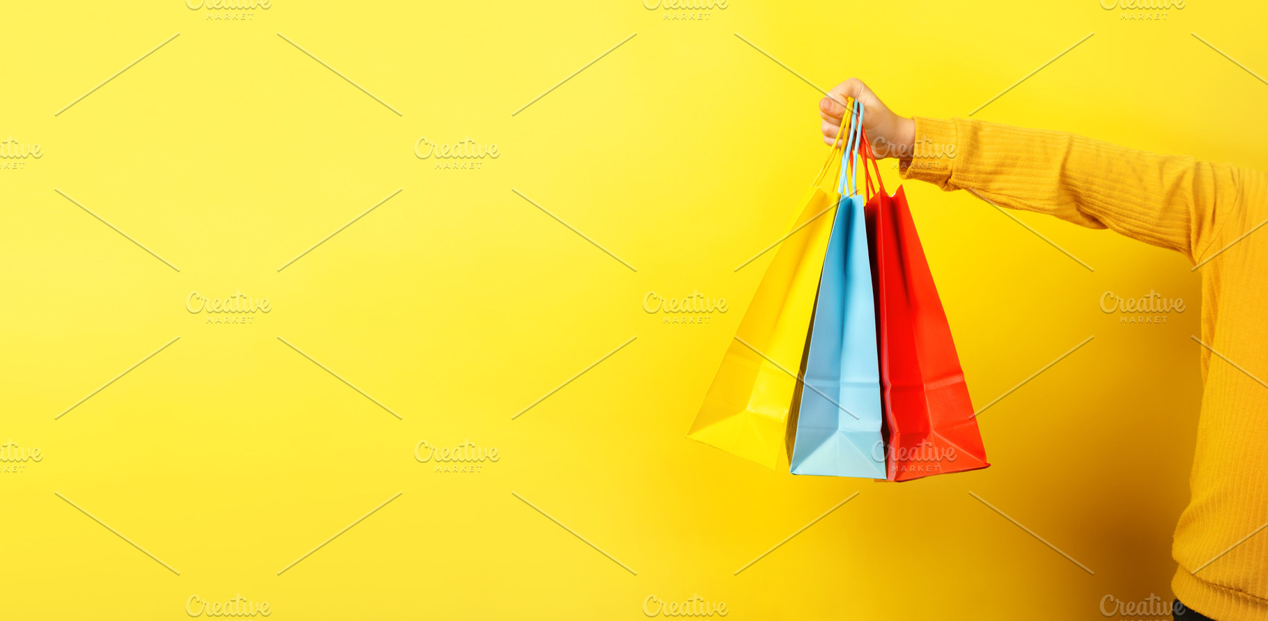 Colorful Shopping Bags on Yellow, a Beauty & Fashion Photo by Ales Munt
