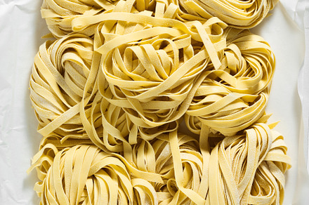 fresh raw Italian tagliatelle pasta, ready for cooking. home mad