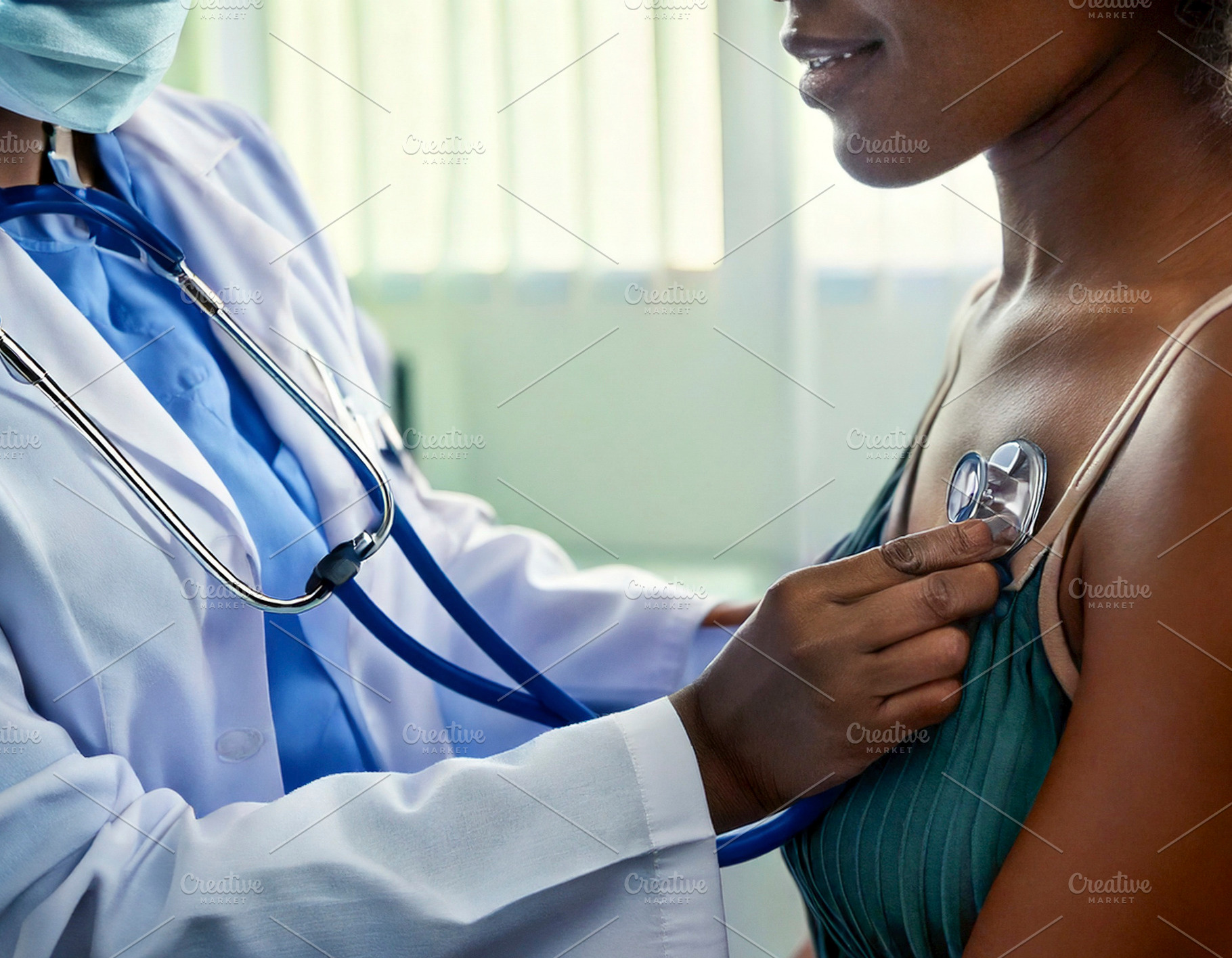 Patient being examined by a doctor using a stethoscope, a Health & Medical Photo by DanFLCreativo