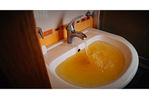 Basin with yellow water creating, a Nature Photo by Our Amazing World