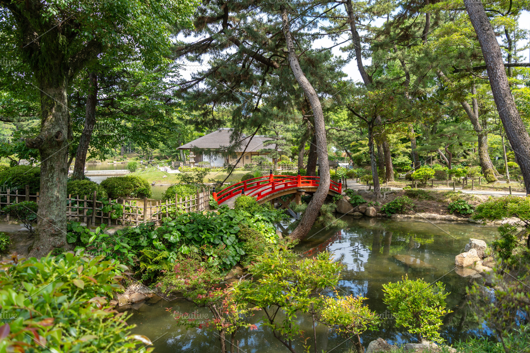 Red bridge in Shukkei-en Japanese garden in Hiroshima, Japan, a Nature Photo by GoodGoods