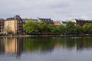 The Lakes. Scenic urban waterfront view with historic buildings and trees in Co, a Photo by AS photostudio