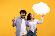 Young excited indian woman holding empty speech bubble and guy pointing finger, a Photo by Prostock-Studio (Thumbnail 1 of 3)