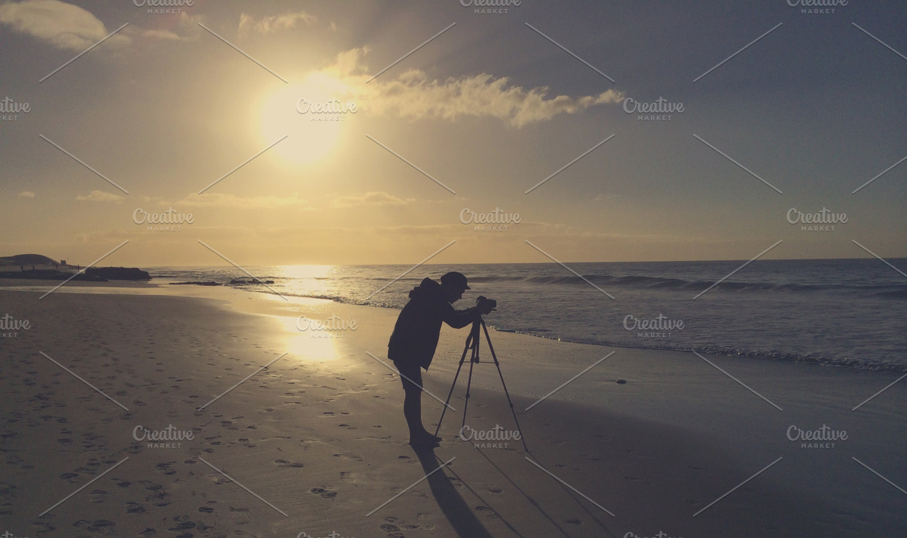Photographer With Camera On A Beach