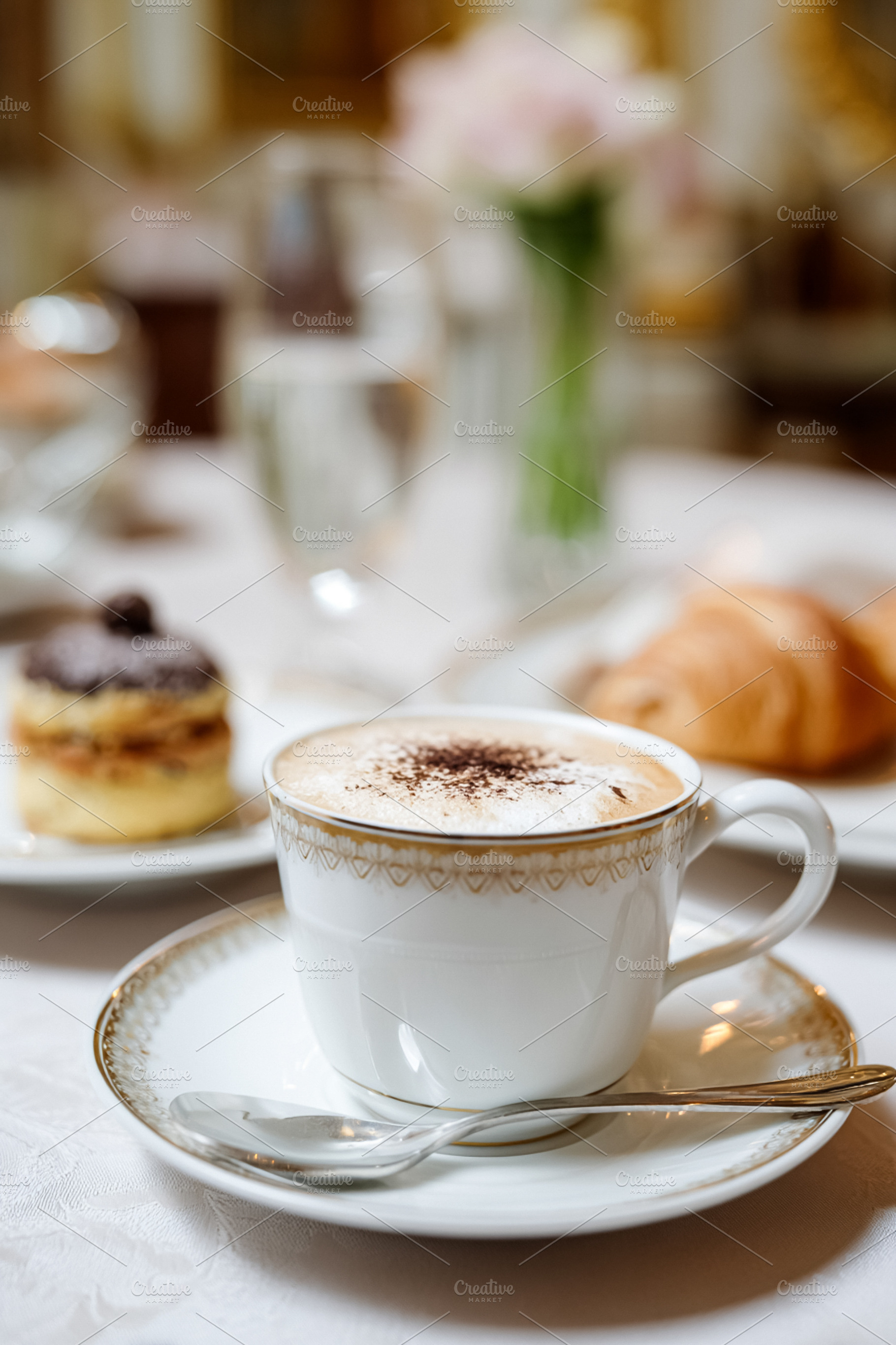 Cappuccino with croissant and pastry on a white table, enjoying, a Food & Drink Photo by Studio ANNA